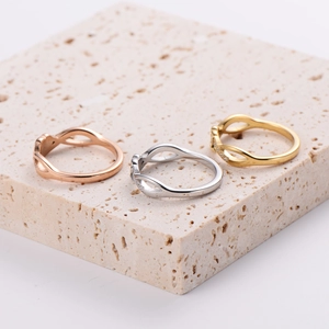 Three-piece stainless steel infinity rings set in rose gold, silver, and gold colors