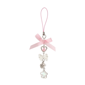 Detail of pink ribbon bow keychain with heart charm and made with love engraved tag