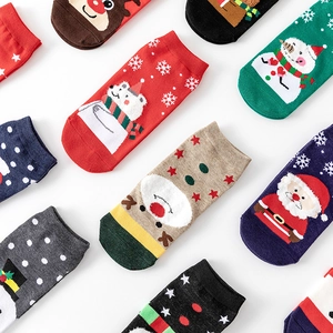 Christmas cotton socks set with Santa and reindeer patterns on white background