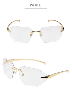 Close-up of rimless geometric sunglasses with gold metal arms and clear faceted lenses