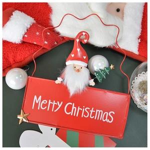 Detail of red metal Merry Christmas sign with Santa Claus and plush beard decoration