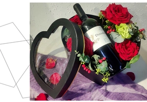 Detailed heart-shaped gift box with transparent window, red roses and red wine bottle