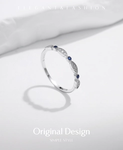 Macro shot of S925 sterling silver ring featuring blue and white zircon and S925 engraving