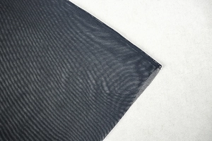 Close-up of premium black mesh fabric detail showing fine breathable net texture