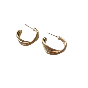 Minimalist geometric twisted gold hoop earrings with polished metal finish for women