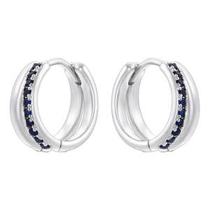 Close-up of luxury double-row hoop earrings with sparkling blue zircons in silver plating