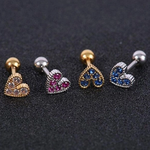Macro shot of 925 silver heart cartilage studs with multicolor cubic zirconia gems