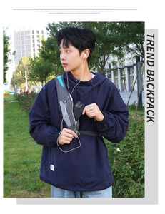 Detail of waterproof sports chest bag with headphone port and stylish blue zipper accents