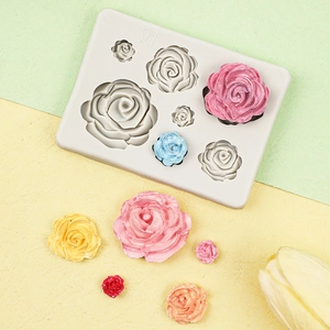Close-up of flexible 3D rose flower silicone mold with colorful resin floral samples