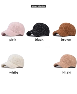 Detail view of plush baseball caps in five colors including pink, black, and khaki