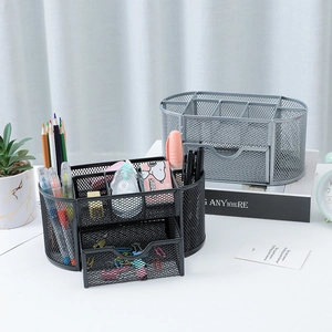 Detail of 9-compartment metal mesh desk organizer with drawers in black and silver finishes