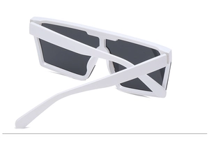 Detail shot of white oversized square sunglasses featuring thick temples and dark lenses