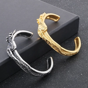 Bracciale rigido aperto con drago vintage in acciaio oro e argento da uomo