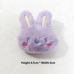 Detail of lavender plush rabbit brooch with embroidery showing 6.5x6cm dimensions