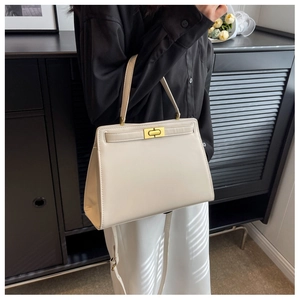 White trapezoidal PU leather handbag with golden twist lock and removable strap