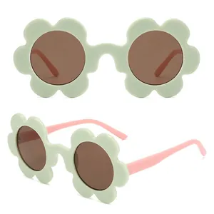 Floral petal frame sunglasses for women in mint green and pink with brown lenses