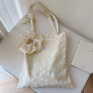 Beige cotton tote bag with white polka dot texture and matching cloud hair scrunchie set