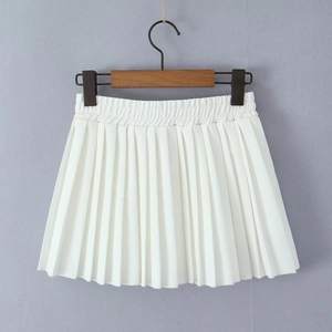Detailed view of white pleated mini skirt featuring an elastic waistband and clean pleats