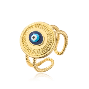 Detailed close-up of golden evil eye ring with blue enamel and twisted rope band texture