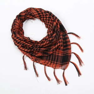 Close-up of tactical Shemagh scarf with red black geometric pattern and fringe detail