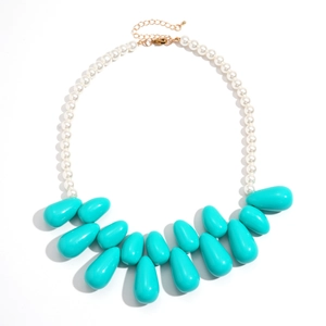 Exaggerated necklace with white pearls and large turquoise resin teardrop pendant