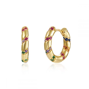 Golden hoop earrings with multi-colored cubic zirconia pave setting on white background