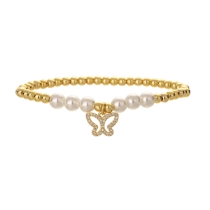 Close-up of golden beaded bracelet featuring white pearls and a crystal butterfly charm