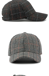 Close-up of the thick tweed plaid fabric and stitching details on the baseball caps