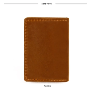Macro shot of heavy-duty stitching on vintage brown crazy horse leather card holder