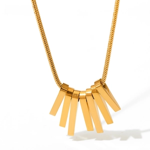 Detail of gold fringe fan pendant on a flexible snake chain necklace with a sleek finish