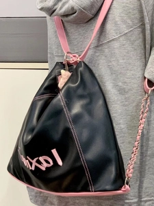 Large black PU leather bucket backpack with pink contrast stitching and chain straps