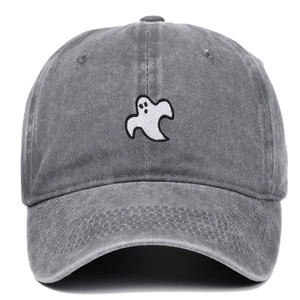 Close-up of white ghost embroidery on washed gray cotton denim baseball cap fabric