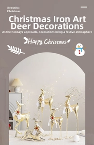 Detailed close-up of golden iron reindeer ornaments with scarves and berry decorations