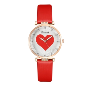 Detail of white radial dial with large red heart pattern and sparkling crystal markers