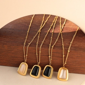 Golden cat eye stone pendant necklaces with bead chains in beige and black variants