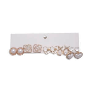 Set of 6 gold and pearl floral geometric earrings for women on a display card