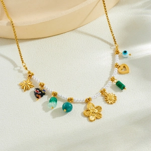 Gold plated stainless steel necklace with camellia flower, turquoise heart and pearl charms