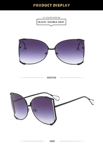 Detail view of square black sunglasses with purple gradient lenses and pearl temple tips