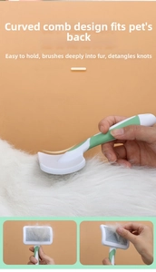 Detail of ergonomic curved pet brush showing hair removal from cat or dog fur