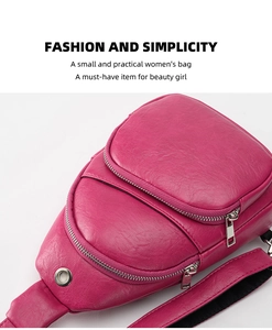 Detail view of pink PU leather chest bag featuring silver metal zippers and a headphone port
