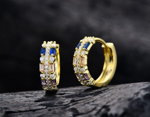 Detailed macro view of S925 sterling silver huggie earrings with colorful zirconia gems