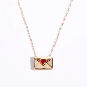Golden envelope necklace with a red heart gemstone featuring I Love You secret message
