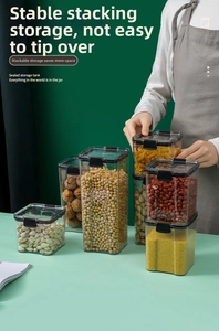 Detail view of airtight food storage containers with black locking lids for pantry