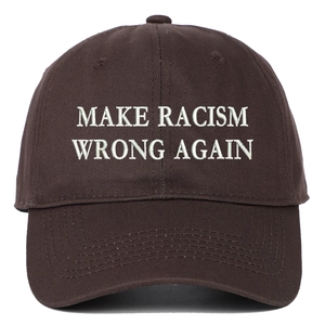 Close-up of white embroidered Make Racism Wrong Again slogan on brown cotton baseball cap