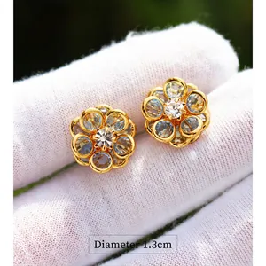 Elegant sky blue crystal flower stud earrings in gold finish, 1.3cm diameter size