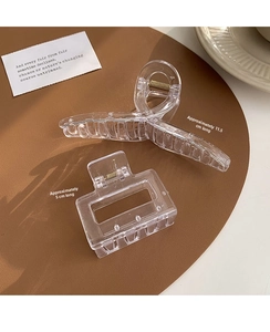 Macro shot of large transparent acrylic hair claws showing 11.5cm and 5cm size details