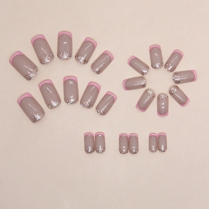 French tip press-on nail kit in peach pink with silver glitter gradient on nude base