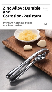 Close-up of durable zinc alloy garlic press with stainless steel finish on a stone tabletop