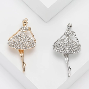 Elegant ballerina brooch set with sparkling rhinestones in gold and silver finish