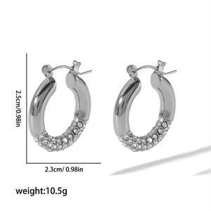 Detail shot of silver hoop earrings showing 2.5cm size, 10.5g weight and zircon inlay